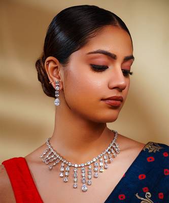 Delicate yet elegant diamond necklace in white finish with matching earrings 1