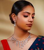 Delicate yet elegant diamond necklace in white finish with matching earrings