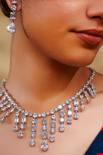 Delicate yet elegant diamond necklace in white finish with matching earrings