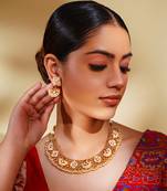 Classy kundan necklace with elegant pair of earrings.