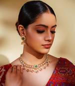 Classy kundan necklace with elegant pair of earrings.