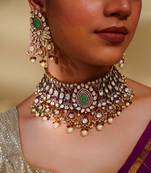 Bold and dramatic kundan necklace with earrings and maangtikka