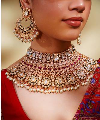 Bold and dramatic kundan necklace with earrings and maangtikka 4