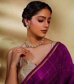 Bold and dramatic two tone finish kundan polki necklace set