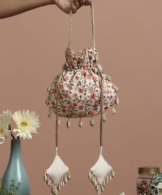 Cream and peach floral potli bag 1
