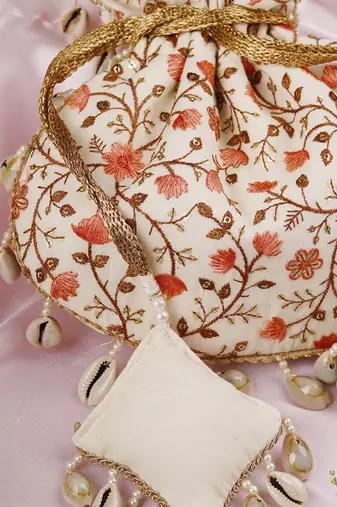 Cream and peach floral potli bag