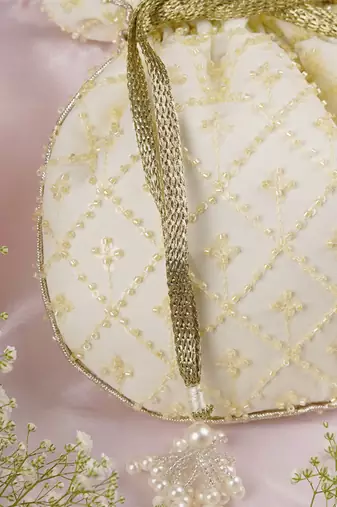 Yellow pure chinon with cutdana potli bag