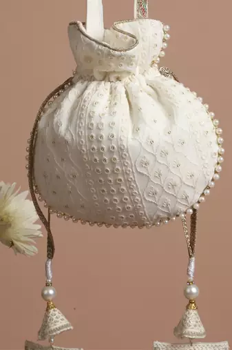 White georgette with gold sequin potli bag