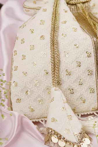 White georgette with gold sequin potli bag