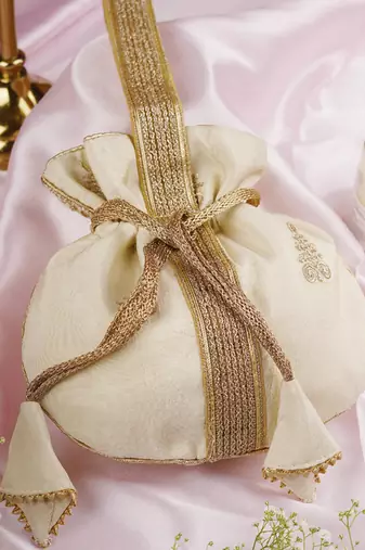 Cream and gold buti silk potli bag
