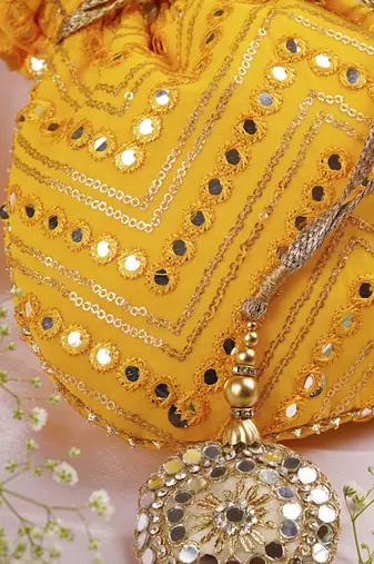 Yellow georgette with mirror work potli bag