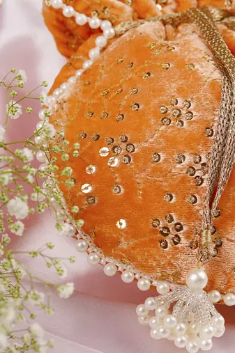 Peach velvet with embroidery potli bag