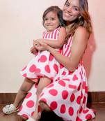 Radiant red polka dot matching dresses for mom and daughter