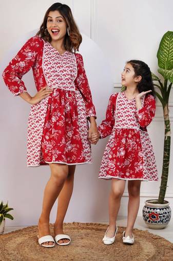 Matching red and white printed dresses for mom and daughter
