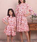 Cute and cozy: matching mommy and me orange printed tiered dress duo