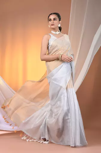 Golden and white tissue soft saree with pompom