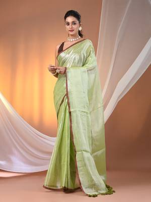 Light green tissue soft saree with pompom 1