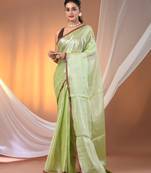 Light green tissue soft saree with pompom