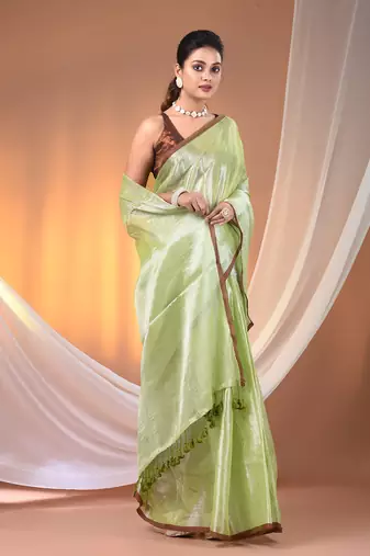 Light green tissue soft saree with pompom