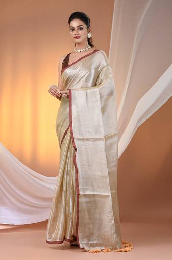 Beige tissue soft saree with pompom