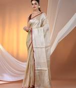 Beige tissue soft saree with pompom