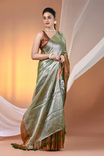 Green and golden tissue soft saree with pompom