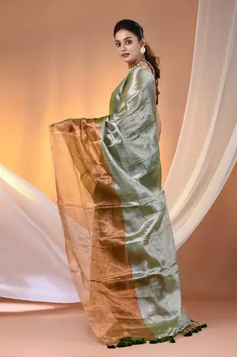 Green and golden tissue soft saree with pompom