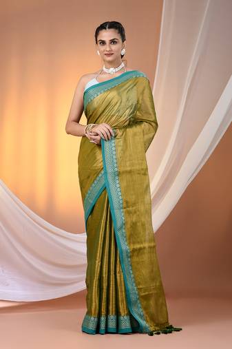 Sap green shimmer tissue saree with nakshi borders