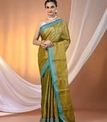Sap green shimmer tissue saree with nakshi borders
