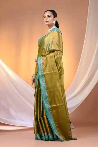 Sap green shimmer tissue saree with nakshi borders