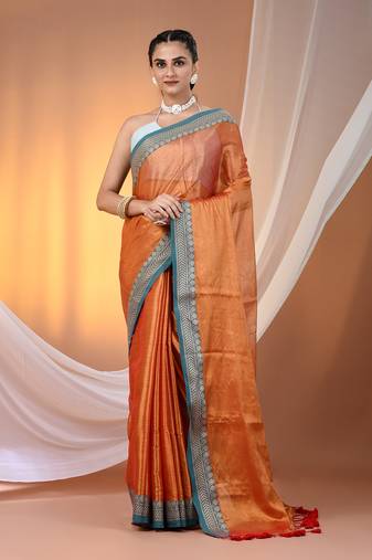 Orange shimmer tissue saree with nakshi borders