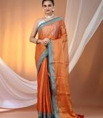 Orange shimmer tissue saree with nakshi borders