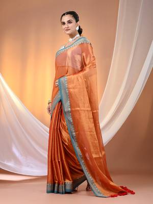 Orange shimmer tissue saree with nakshi borders 2