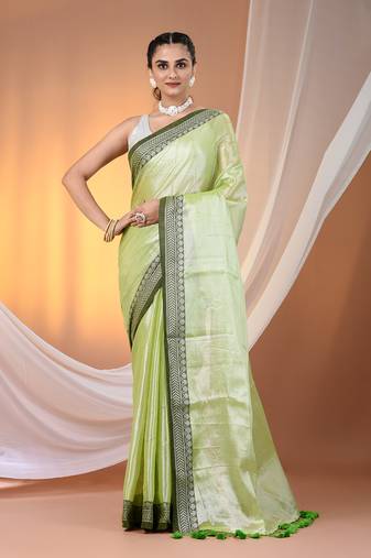 Light green shimmer tissue saree with nakshi borders