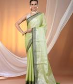 Light green shimmer tissue saree with nakshi borders