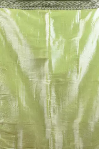 Light green shimmer tissue saree with nakshi borders