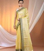 Yellow shimmer tissue saree with nakshi borders