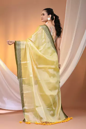 Yellow shimmer tissue saree with nakshi borders