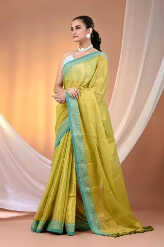 Lime green shimmer tissue saree with nakshi borders