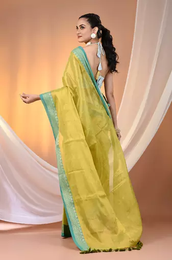 Lime green shimmer tissue saree with nakshi borders