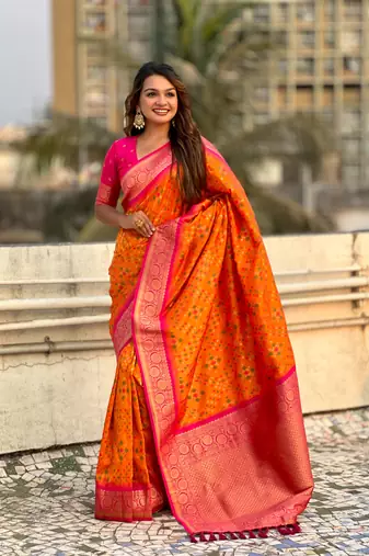 Orange patola silk blend weaving ikkat meenakari saree