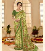 Light green woven border with ikkat printed cotton silk blend saree