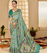 Fountain blue woven border with ikkat printed cotton silk blend saree