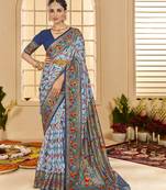 Light blue woven border with ikkat printed cotton silk blend saree