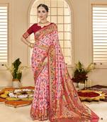 Peachy pink woven border with ikkat printed cotton silk blend saree