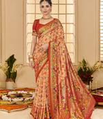Pastel orange woven border with ikkat printed cotton silk blend saree