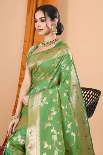 Green faux banarasi silk blend saree with woven zari work