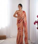 Peach georgette saree with hand print and moti lace border