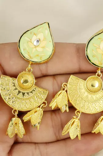 Gold finish ethnic look earrings