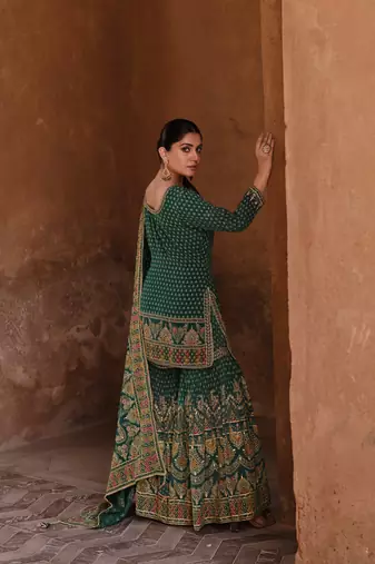 Green embroidered crepe Salwar Suit